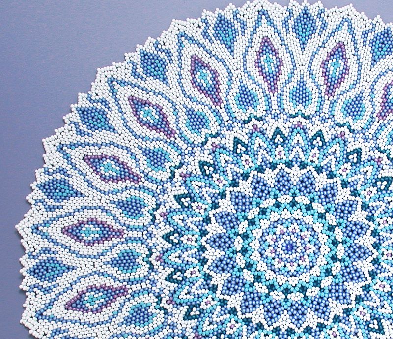 Detail of Blue beaded doily like a Turkish plate