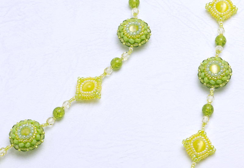 Puffy Circle and Square Necklace: closeup of the yellow necklace