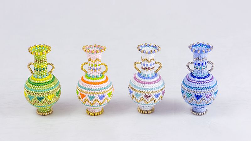 Triangle Pattern Bottle: Green, Pink, White, and Blue